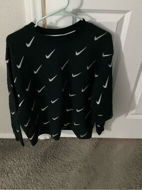 Nike Black Crewneck Sweater with White Swoosh Pattern